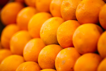 Ripe oranges forming background on farmers market