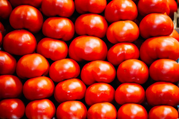 Fresh ripe red  tomatoes forming background