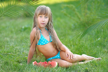 portrait of little girl outdoors in summer © zagorodnaya