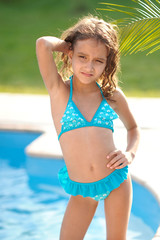 portrait of little girl outdoors in summer