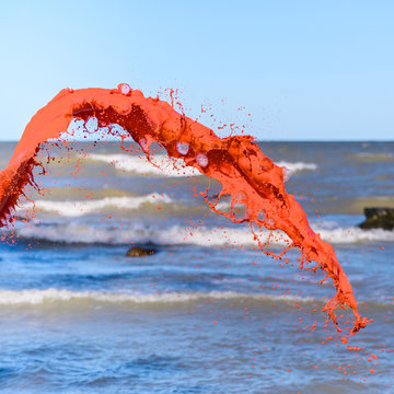 Red liquid on sea background