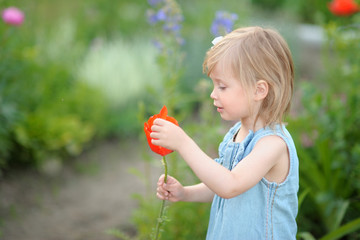 portrait of little girl outdoors in summer