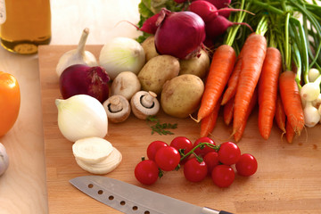 Pile of organic vegetables on a wooden table