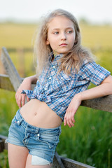 portrait of little girl outdoors in summer © zagorodnaya