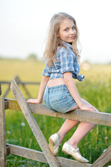 portrait of little girl outdoors in summer