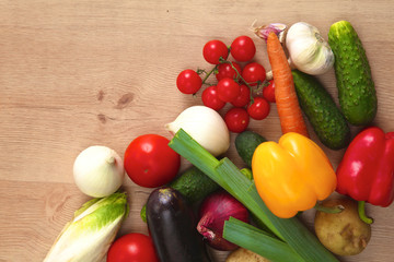 Pile of organic vegetables on a wooden table