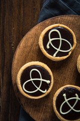 Hand decorated artisan chocolate tarts