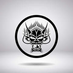 Dragon head silhouette in a circle