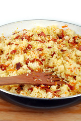 dish of rice with ham carrots and onion