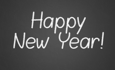 Happy new year 2016, hand writing with chalk on blackboard,