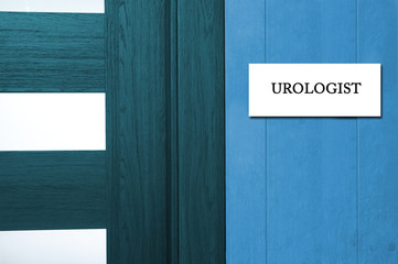 In the doctor's office on the study of urological. At the clinic - Information plate at the door in the clinic.

