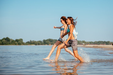 Naklejka premium Women At The Beach