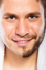 Fototapeta premium Happy man with half shaved face beard hair.