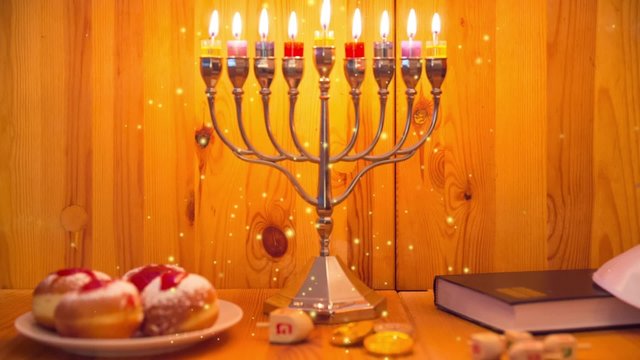 Jewish Holiday Hanukkah with Menorah (traditional Candelabra), donuts ( sufganiyot ) and wooden dreidels with glitter overlay - Zoom Out
