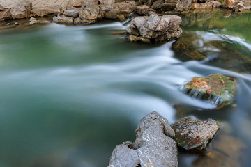 The stream flowing water in the autumn