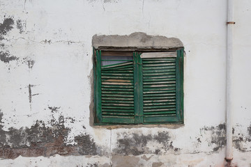 Fototapeta na wymiar old wooden window shutter - vintage wall background