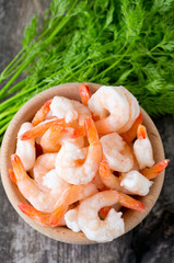 frozen shrimps on wooden surface