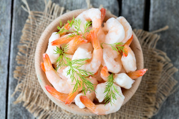 frozen shrimps on wooden surface