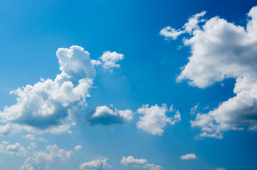 Naklejka na ściany i meble White cloud in the blue sky