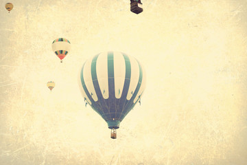 Vintage textured hot air balloons in flight