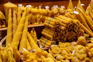 Honey candles at the Christmas market in Vienna, Austria. - 97609888