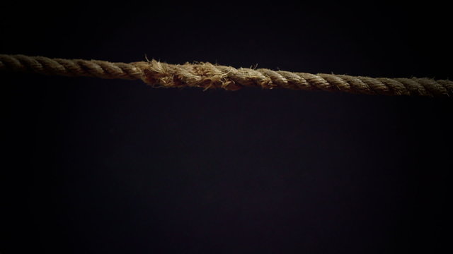 Tension of a Panic Attack Illustrated with Breaking Rope in Super Slow Motion