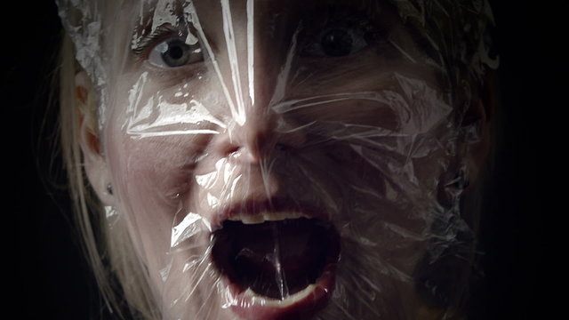 Young Woman Comparing a Panic Attack to Suffocating into a Plastic Bag