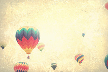 Vintage textured hot air balloons in flight