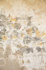 textured wall with beige, grey and yellow and white paint