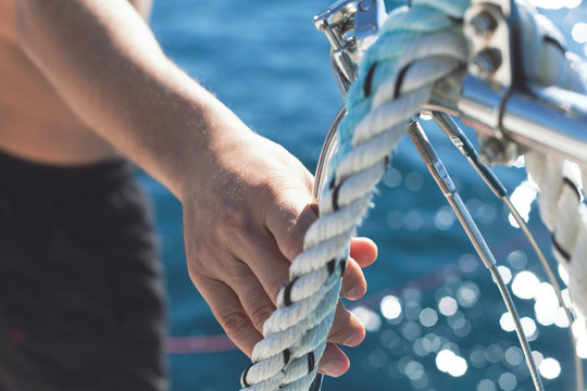 man entering the sea from the yacht