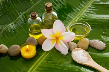 Rolgordijnen Health spa with massage oil and two orchid, candle on leaf © Mee Ting