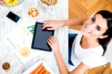 Young beautiful woman with a Tablet PC at home