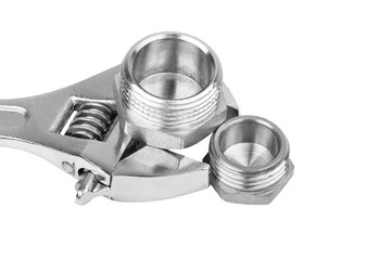 Plumbing fitting and wrench