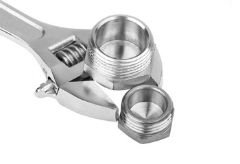 Plumbing fitting and wrench