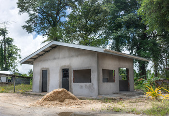 Fototapeta na wymiar Newly built house with trees in the background, Trinidad, Trinidad And Tobago