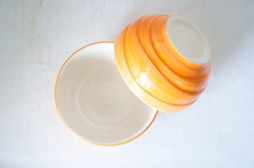 Empty orange ceramic bowl