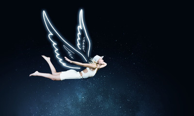 Obraz na płótnie Canvas Angel girl flying high