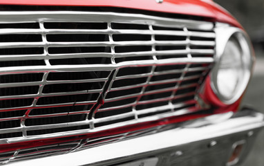 Close-up of radiator grille of a red classic vintage car