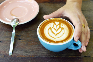 a cup of latte art coffee.