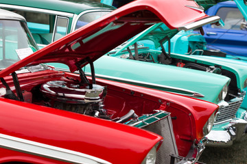 Open bonnets of shiny classic vintage cars