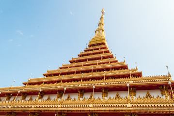 Golden pagoda at Wat Nong Wang public temple against sun light,