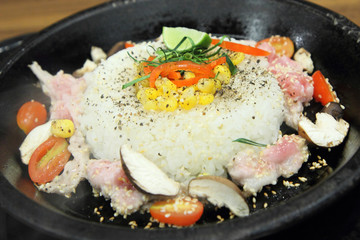 pork rice and herb in hot pan