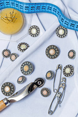 Buttons, pins, needles. Needlework.