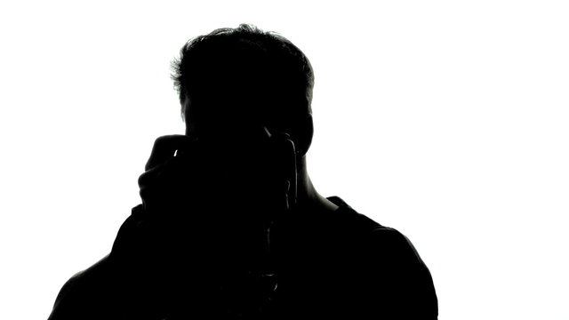 Young Adult Photographer in Silhouette Taking Photos and Rotating Over White Background