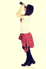 Young woman with binoculars.