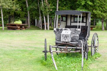 Old style stage coach on field