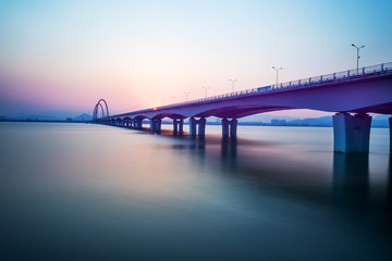 Fototapeta na wymiar sunrise skyline and landscape of bridge over river