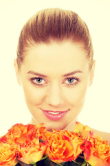 Fototapeta premium Smiling woman with fresh roses.
