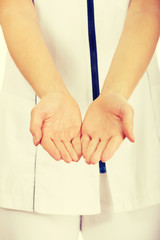Medical doctor woman with open hands.