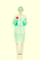 Female doctor with heart model.